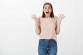 Girl sharing outstanding achievement, cannot hide happiness. Portrait of joyful pleased cute woman in trendy t-shirt