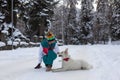 Girl with shepherd dog on the snow, winter time Royalty Free Stock Photo
