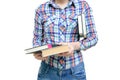 Girl in a shirt and jeans holds books in her hands. White isolate Royalty Free Stock Photo