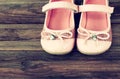 Girl shoes over old wooden deck floor Royalty Free Stock Photo
