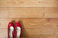 Girl shoes over wooden deck floor. Royalty Free Stock Photo