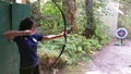 Girl Shooting Bow and Arrow Royalty Free Stock Photo