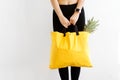 Girl with a shopping bag in yellow hands with.products. Take away, fitness food