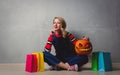 Girl with shopping bags and Halloween pumpkin Royalty Free Stock Photo