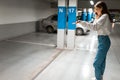 Girl after shopping discovered the loss of her automobile. Angry woman talking about missing car on phone. Vehicle theft concept.