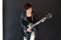 Girl with short hair in leather jacket