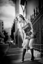 Girl short skirt and bag walking on street.Young European Girl in Urban Setting Royalty Free Stock Photo