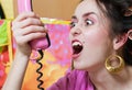 Girl shout with pink phone Royalty Free Stock Photo