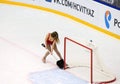 Girl with shovel clean an ice