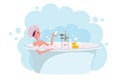 Girl in shower cap taking a bath full of soap foam.Yellow rubber duck in bathtub. Woman takes bath in exquisite bathtub. Relaxing Royalty Free Stock Photo