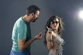 Girl showing arrogance to a guy pleasing her Royalty Free Stock Photo