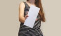Girl showing aslant blank white flyer brochure booklet. Leaflet