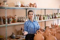 Girl showing finished ceramic production