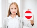 Girl showing no entry sign