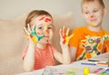 Girl showing painted hands. Hands painted in colorful paints. Education, school, art and painitng concept