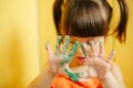 Girl showing painted hands Royalty Free Stock Photo
