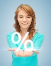 Girl showing sign of percent in her hand Royalty Free Stock Photo