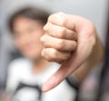 Girl showing thumbs down hand Royalty Free Stock Photo