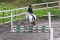 Girl at a showjumping competition.