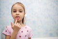 The girl shows her mouth without one milk tooth that has fallen out Royalty Free Stock Photo