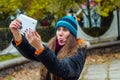 Girl shows language for photos on the tablet Royalty Free Stock Photo