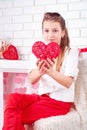 Girl shows red heart