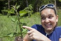 Girl shows stinging nettle leaves Royalty Free Stock Photo