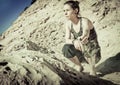 A girl sifts sand through her fingers