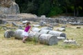 A girl sightseeing historical ruins of Asclepieion