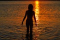 Girl silhouette looking beach sunset