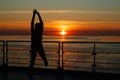 Girl silhouette in magical sunset over the Gulf of Finland, Baltic sea