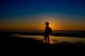 Girl silhouette at a seaside Royalty Free Stock Photo