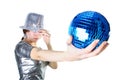 Girl with silver hat holding blue disco ball Royalty Free Stock Photo