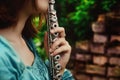 Girl with a silvery flute. Royalty Free Stock Photo