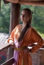 Girl in a simple retro orange dress Royalty Free Stock Photo