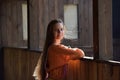 Girl in a simple retro orange dress Royalty Free Stock Photo