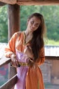 Girl in a simple retro orange dress Royalty Free Stock Photo