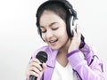 Girl singing into her mike Royalty Free Stock Photo