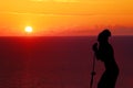 Girl singing at sunset silhouette Royalty Free Stock Photo