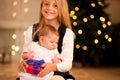 Girl and sister baby at Christmas Royalty Free Stock Photo