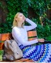 Girl sit bench relaxing in shadow, green nature background. Woman blonde take break relaxing in park. Why you deserve Royalty Free Stock Photo