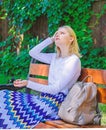 Girl sit bench relaxing in shadow, green nature background. Woman blonde take break relaxing in park. Why you deserve Royalty Free Stock Photo