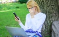Girl sit grass with notebook. Save your time with shopping online. Sales manager occupation benefits. Woman with laptop Royalty Free Stock Photo