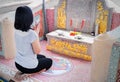 Girl sit and pay respect at grave of her family in Chen Ming Festival