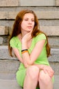 A girl sits on the dock Royalty Free Stock Photo