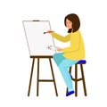 The girl sits at the easel and paints a picture. The artist holds a brush and a palette of paint Royalty Free Stock Photo