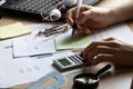 The girl sits at her desk and draws up graphs and histograms about income, business and finance, planning , economics