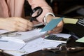 The girl sits at her desk and draws up graphs and histograms about income, business and finance, planning , economics