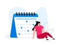 The girl sits near the calendar. Calendar Planning. Working and day planning. Reminder and timetable. Royalty Free Stock Photo