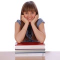 Girl sits table and has put hands Royalty Free Stock Photo